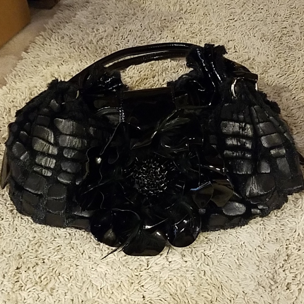Black patent leather, furry flower bag